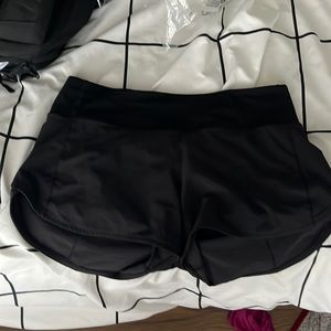 black lulu mid rise speed ups 4”